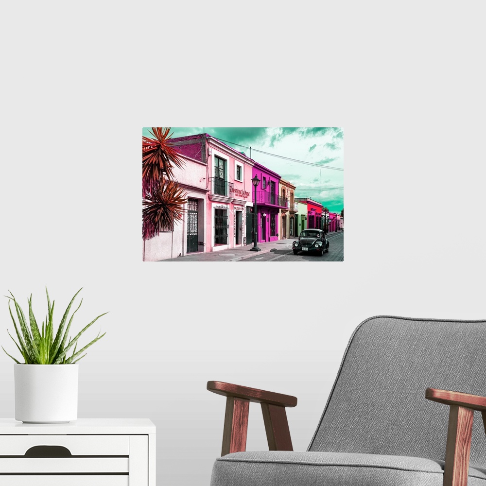 A modern room featuring Colorful photograph of pink facades and a black Volkswagen Beetle driving down the street. From t...