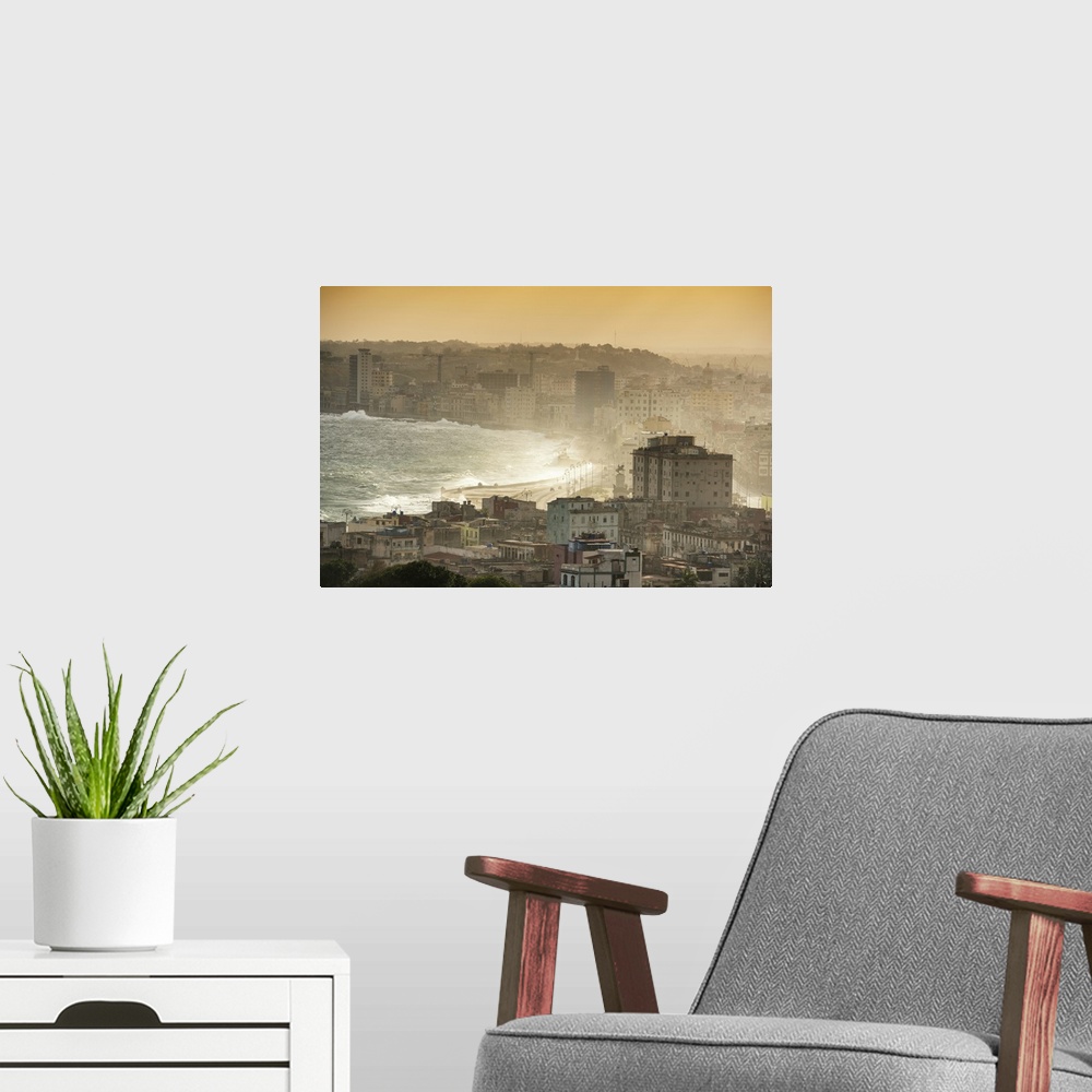 A modern room featuring Aerial photograph of the ocean meeting the city of Havana at sunrise.