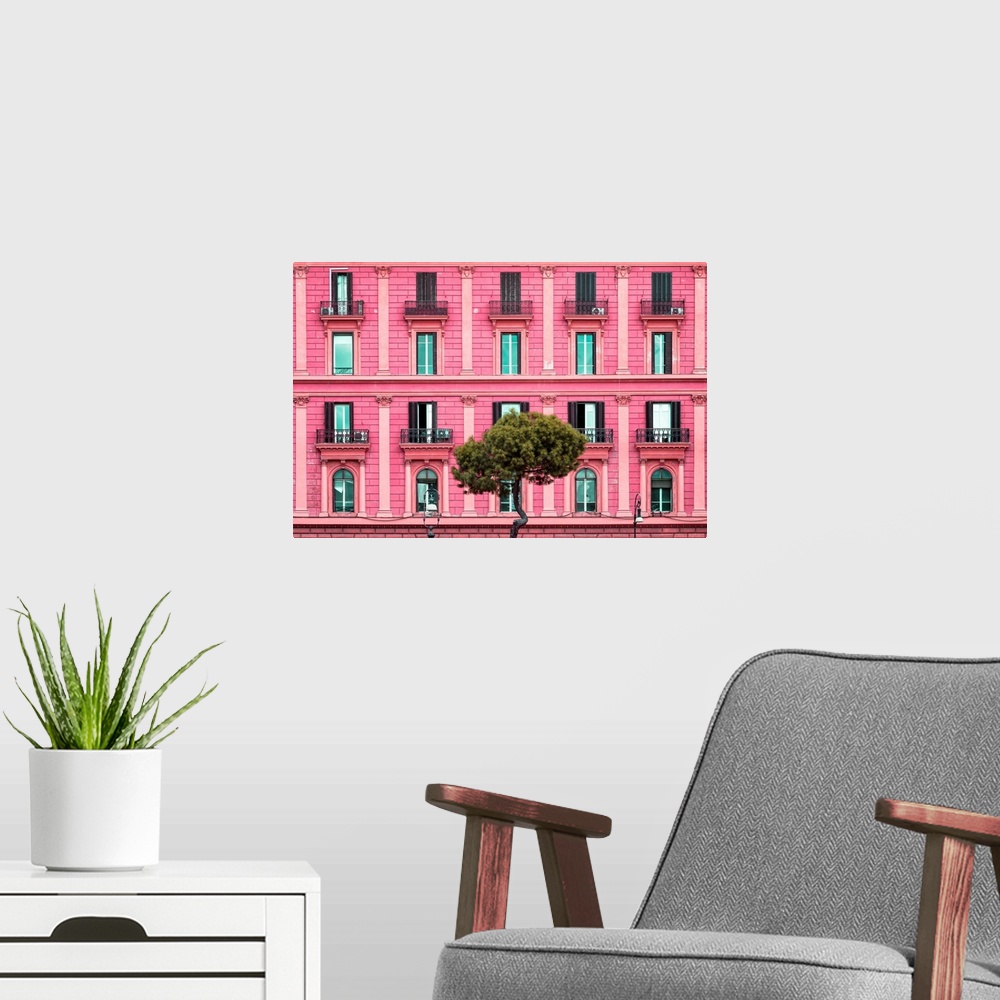 A modern room featuring It's a pink facade of a building in the city of Rome in Italy.