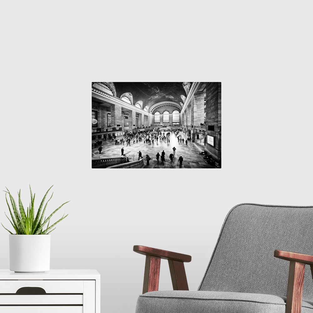 A modern room featuring A black and white photograph of the interior of Grand Central Station in New York City.