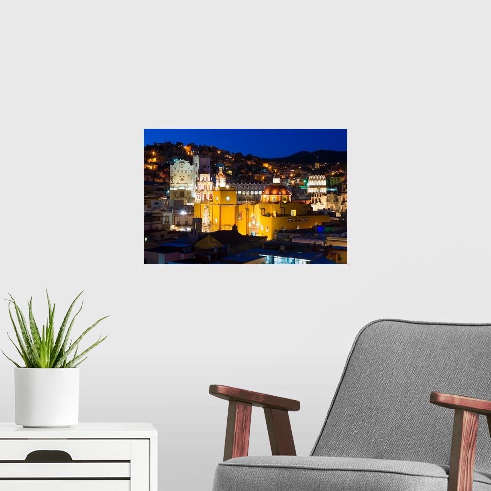 A modern room featuring Nighttime photograph of the iconic Yellow Church, Church of San Diego, in Guanajuato, Mexico. Fro...