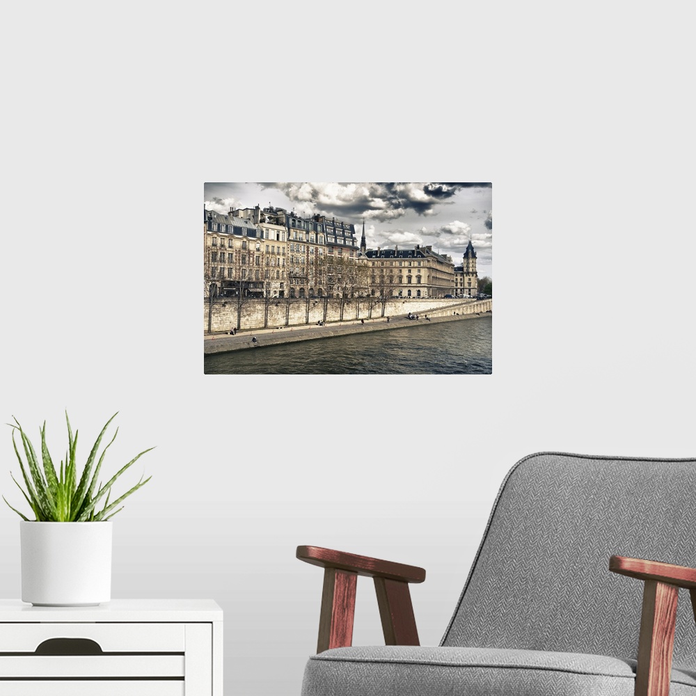 A modern room featuring Fine art photo of the buildings in the heart of Paris, surrounded by the Seine river.