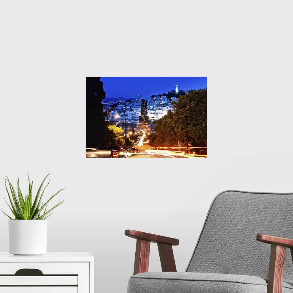 A modern room featuring A time lapse photo of the street famous for its hairpin turns in the evening.