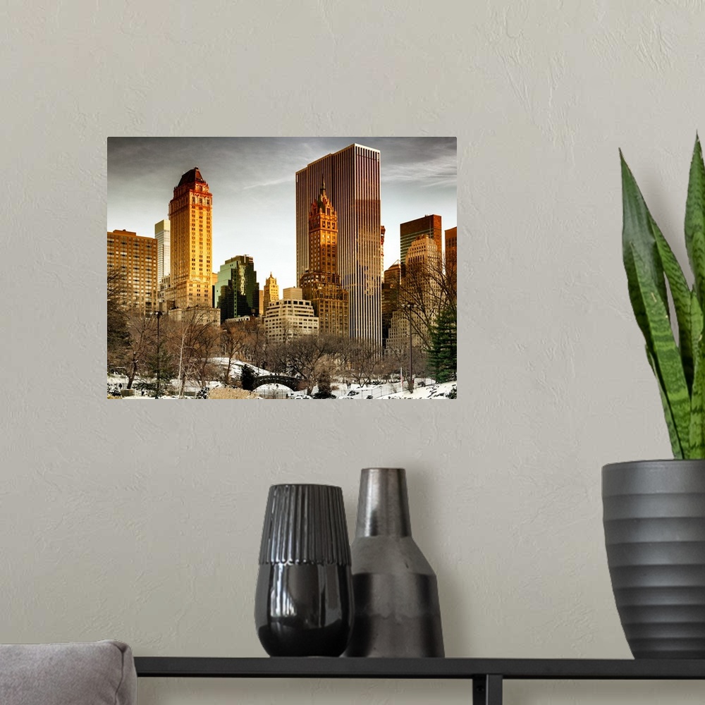 A modern room featuring A photograph of New York city at sunset from Central Park.