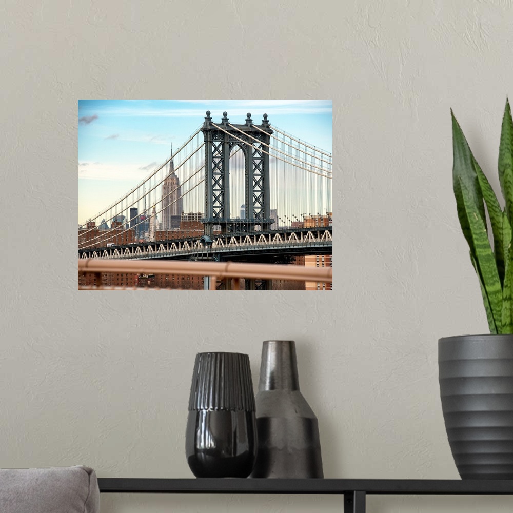 A modern room featuring A photograph of the Manhattan bridge, with the Empire state building in the background.