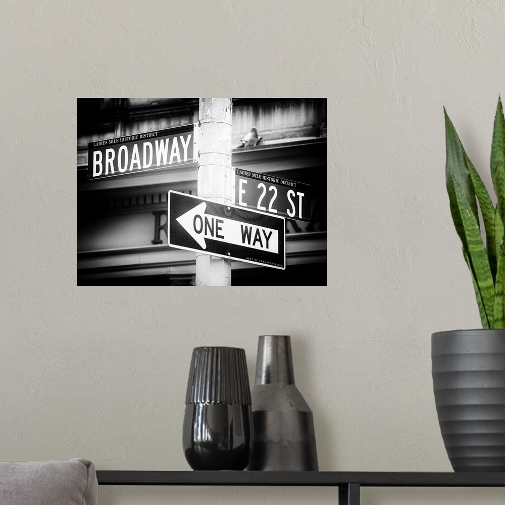 A modern room featuring A photograph of New York city street signs.