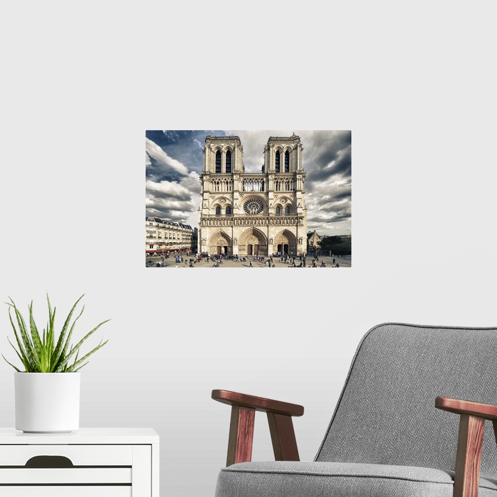 A modern room featuring Fine art photograph of the front of the Notre Dame of Paris Cathedral with a vivid sky.