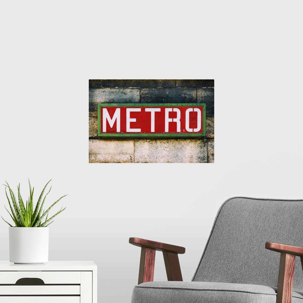 A modern room featuring Photograph of a Parisian sign against a stone wall.