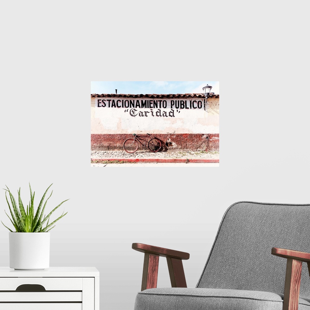 A modern room featuring Photograph of a red bicycle parked in front of a wall with the phrase "Estacionamiento publico" (...