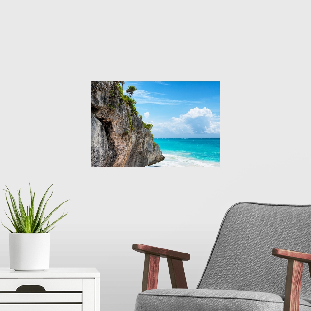 A modern room featuring Photograph of a giant rock with tropical vegetation and palm trees hanging over the clear Caribbe...