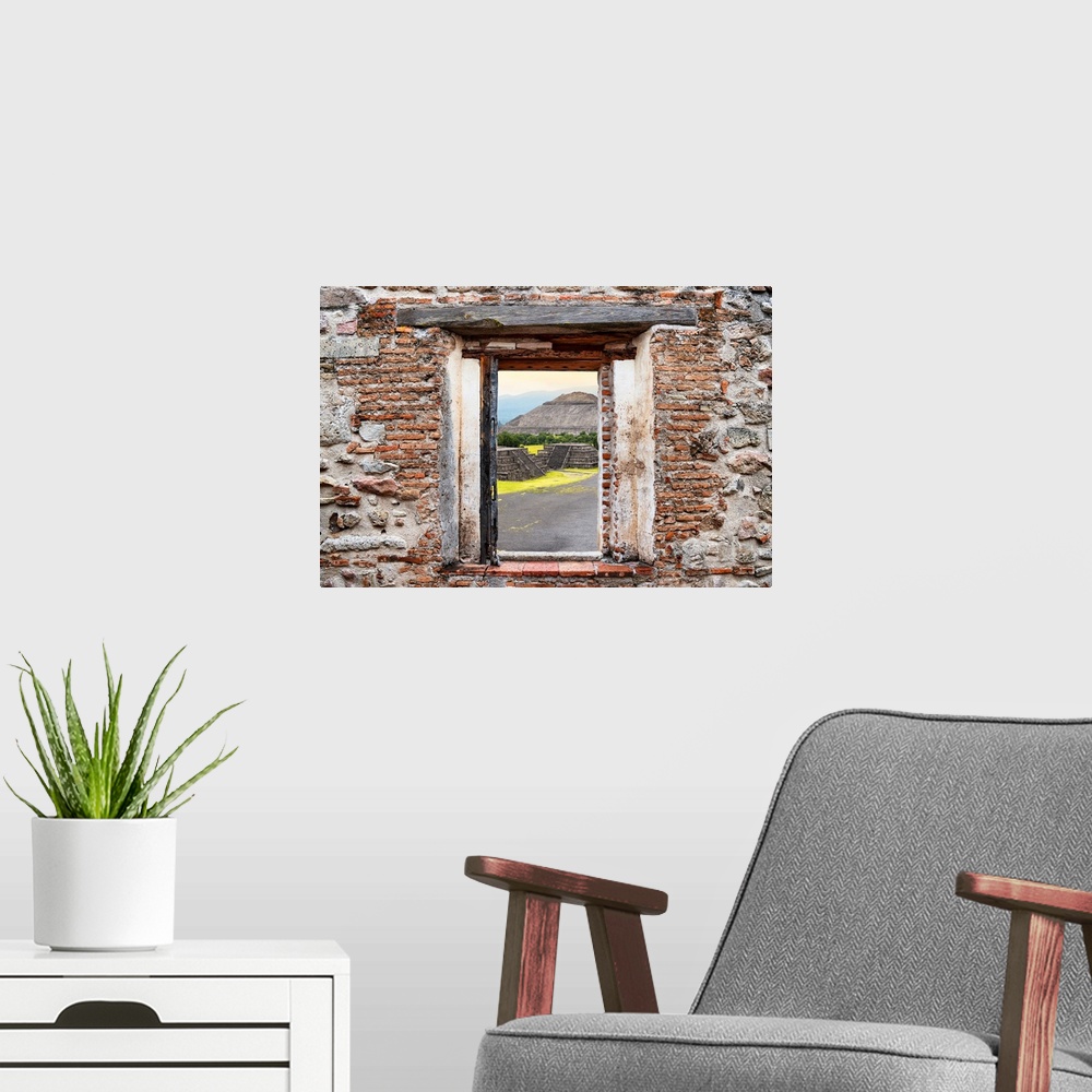 A modern room featuring View of the Teotihuacan Pyramids framed through a stony, brick window. From the Viva Mexico Windo...
