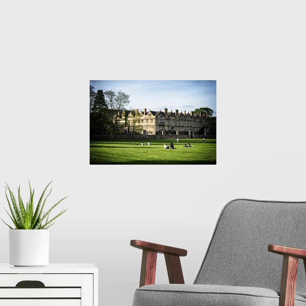 A modern room featuring Fine art photo of students on the lawn at the University of Oxford.