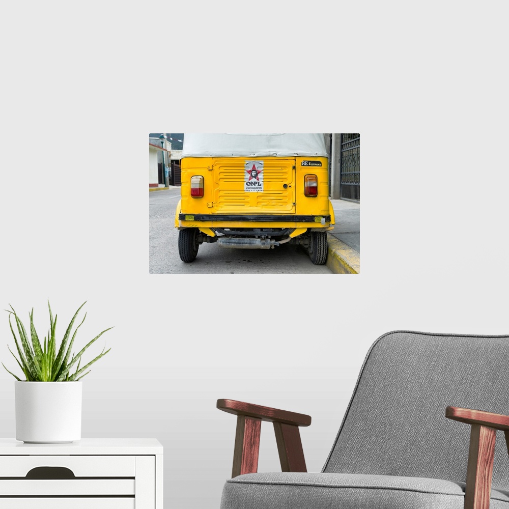 A modern room featuring Close-up photograph of the rear side of a yellow tuk tuck (taxi) in Mexico. From the Viva Mexico ...