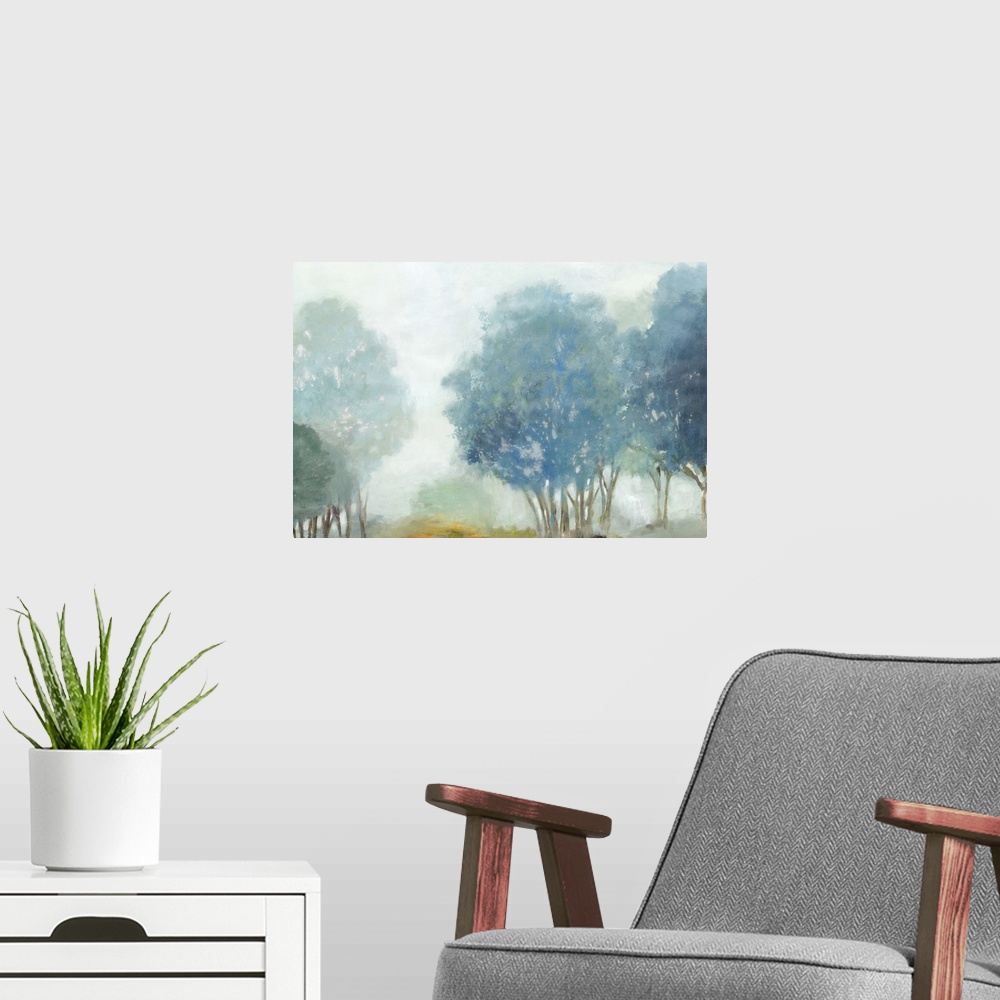 A modern room featuring Contemporary artwork of a misty valley with blue trees.