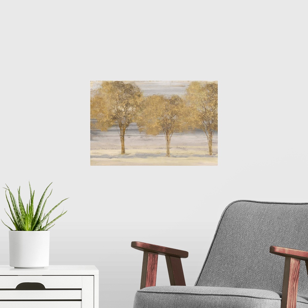 A modern room featuring Horizontal painting of a group of trees done in textured gold.