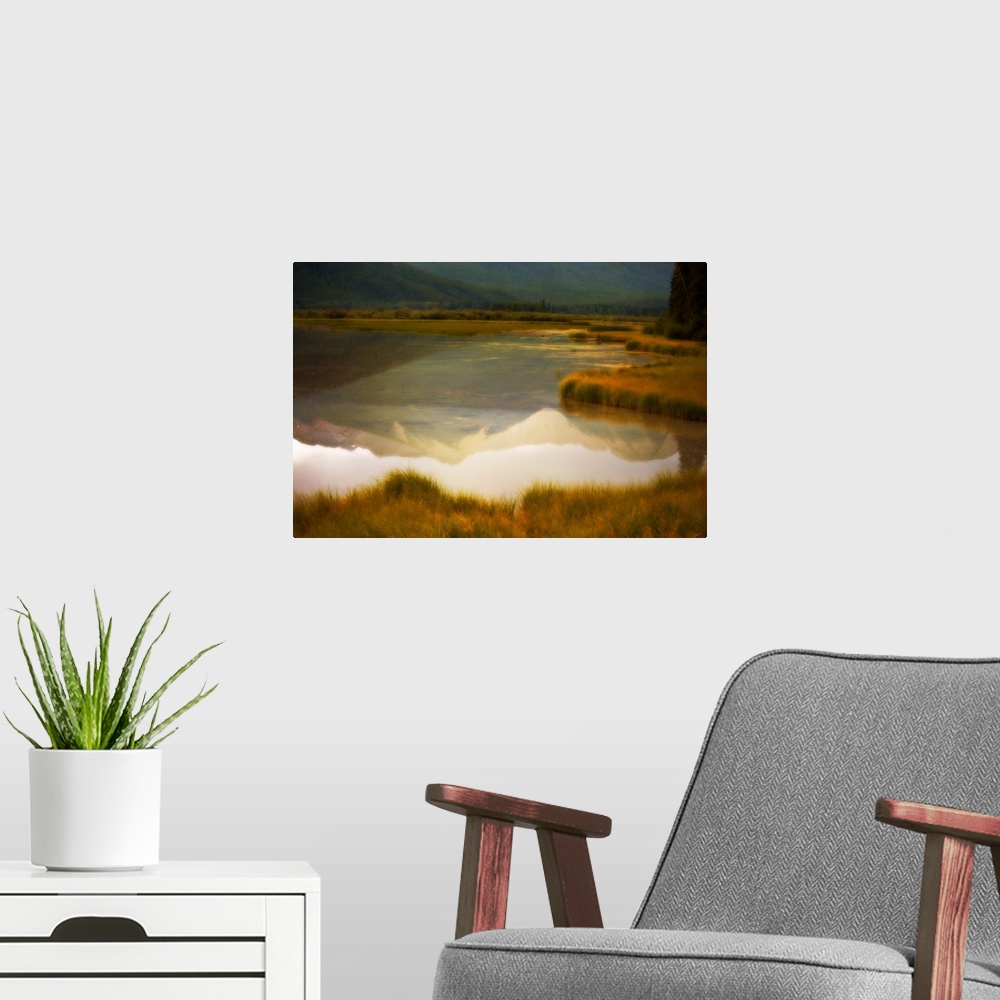 A modern room featuring A photograph of a mountain reflection in a lake with a distressed overlay to the photo.