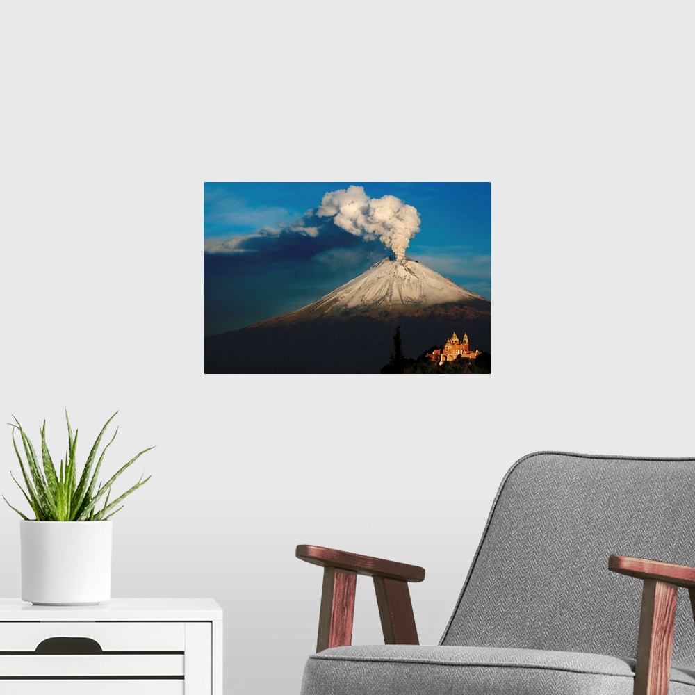 A modern room featuring Clouds of ash rising from snowy  Popocatepetl volcano, Mexico.