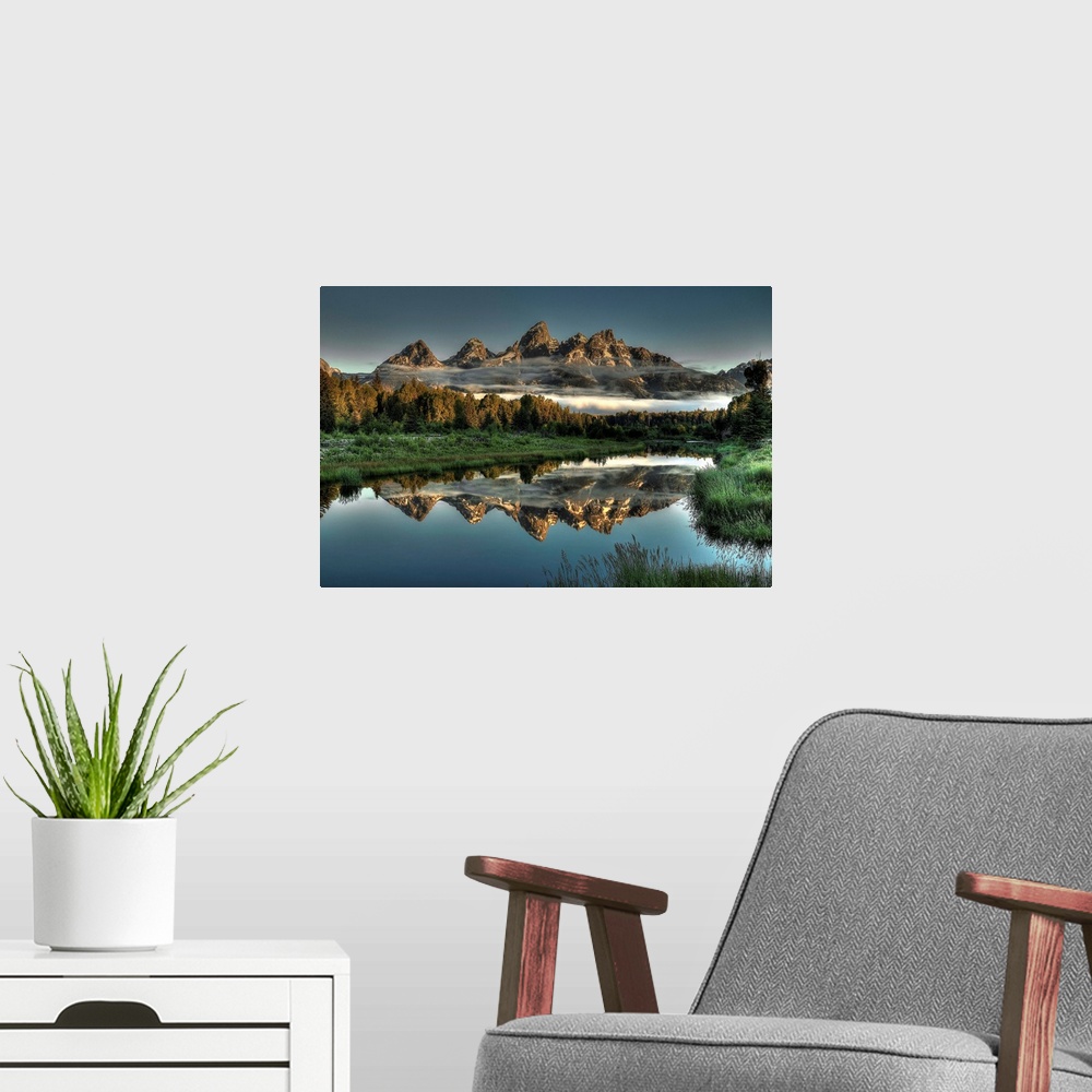 A modern room featuring A unique morning at Schwabacher's landing, with two rows of clouds under the mountain peaks.