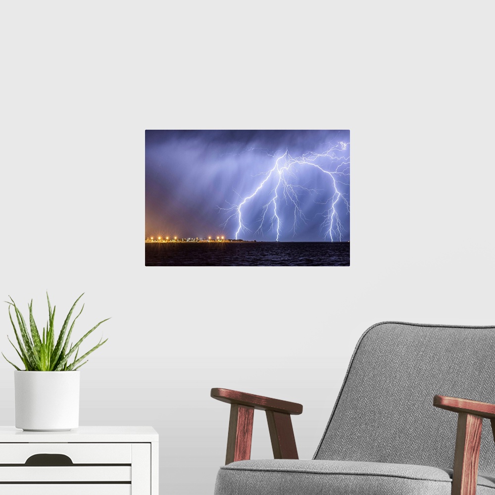 A modern room featuring Lightning storm over Garden Island Navel Base, Rockingham, Australia.