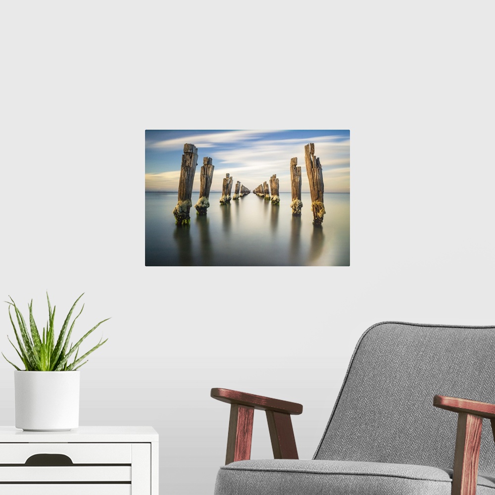 A modern room featuring Clifton Springs Pier at sunset, Victoria, Australia.