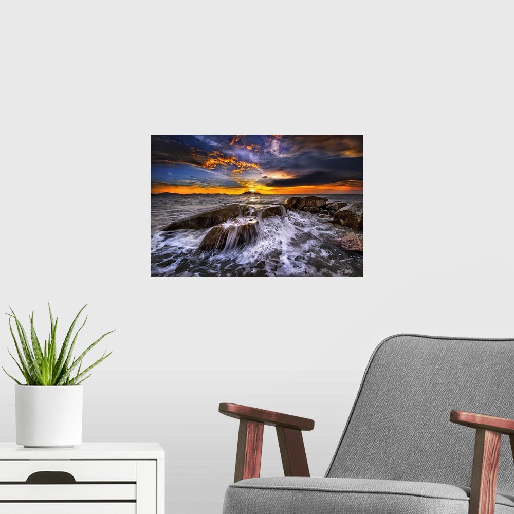 A modern room featuring Photograph of a seascape at sunset with intense warm and cold clouds in the sky.