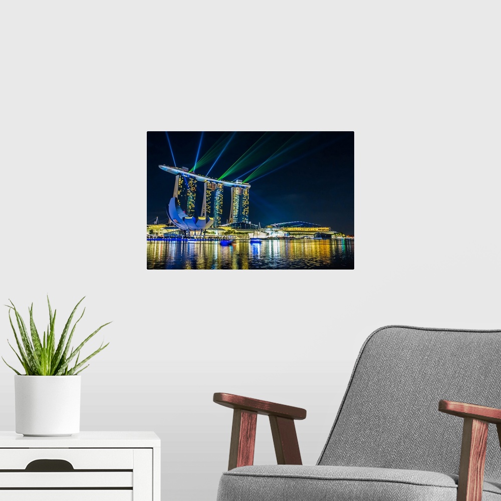 A modern room featuring Light show over the marina in Singapore in the evening.