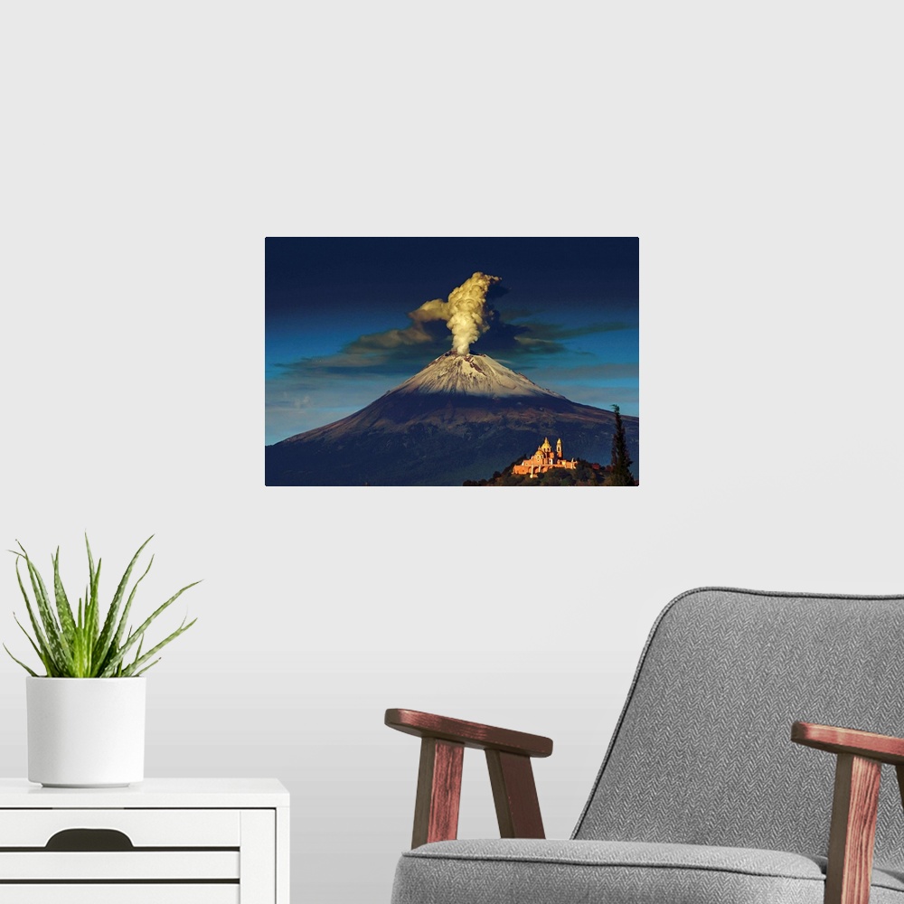 A modern room featuring Smoking Popocatepetl volcano in Mexico in the dawn light.