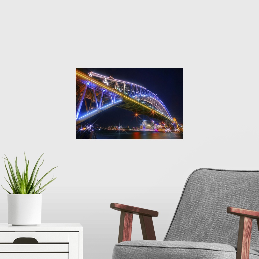 A modern room featuring Photograph of the Sydney Harbor skyline from under the massive neon lit bridge.