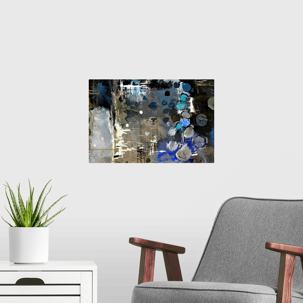 A modern room featuring Abstract painting of colors of blue, white and black in bold brush strokes and splattered paint.