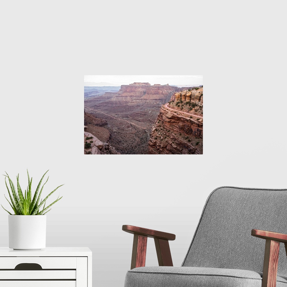 A modern room featuring View of the rocky desert landscape with mesas in the distance, seen from Shafer Trail in Canyonla...