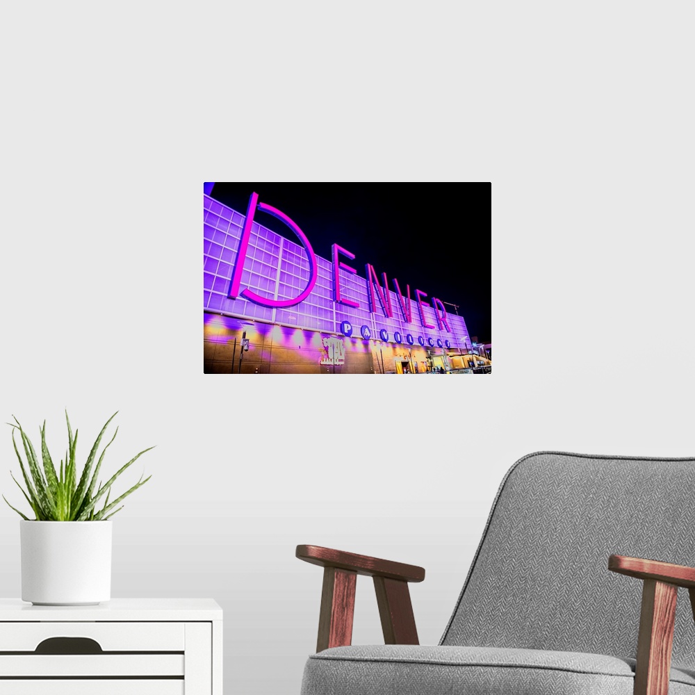 A modern room featuring Photo of Denver Pavilions neon sign, Colorado.