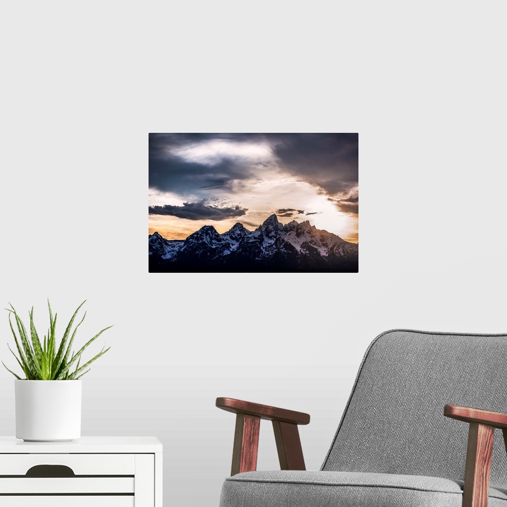 A modern room featuring View of dramatic clouds over Teton mountains in Wyoming.