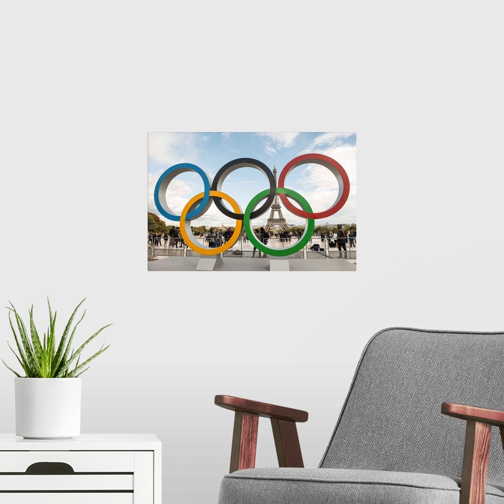 A modern room featuring Photograph of the Olympic Rings with the Eiffel Tower in the background.