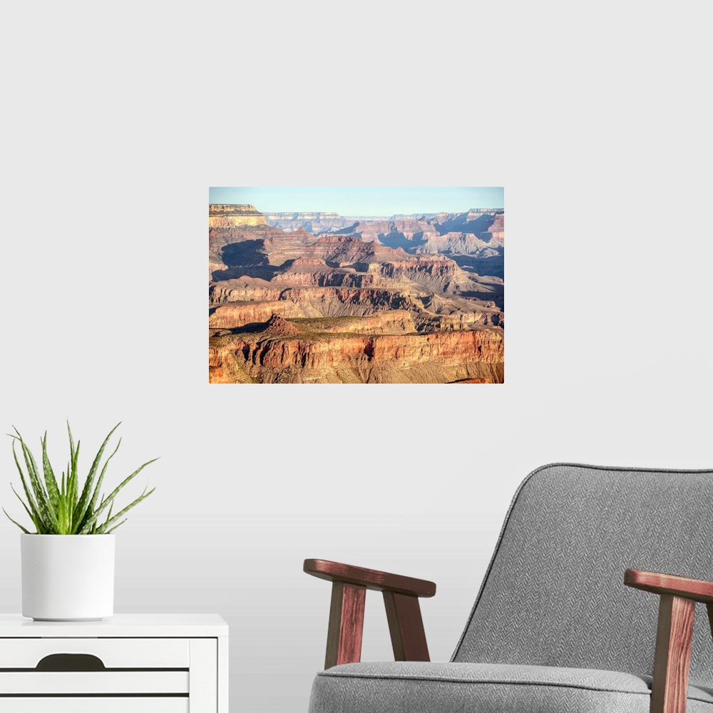 A modern room featuring Elevated view of geological formations at sunrise in Grand Canyon National Park, Arizona.