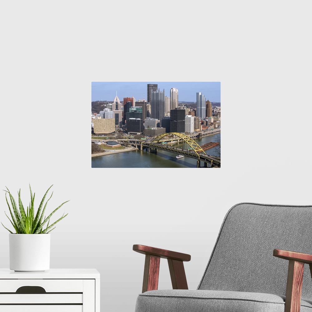 A modern room featuring Aerial view of Pittsburgh, Pennsylvania, with the Fort Pitt Bridge leading into the city.