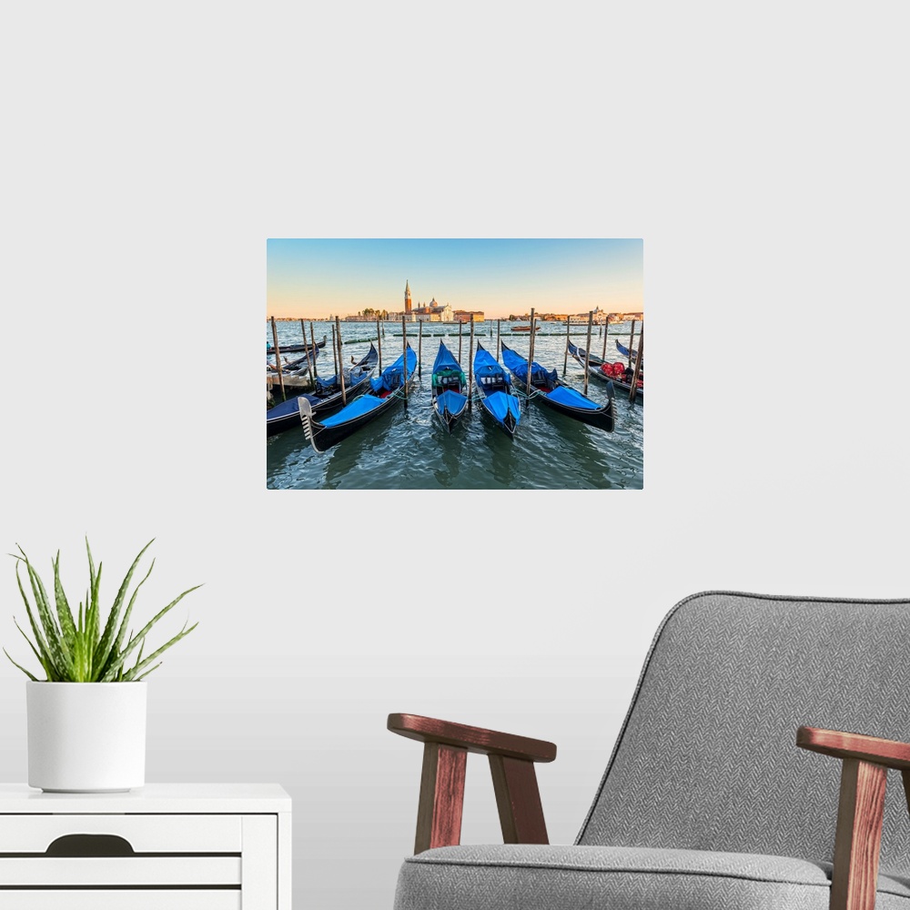 A modern room featuring Photograph of a row of docked gondolas with St. Mark's Square (Piazza San Marco) in the backgroun...
