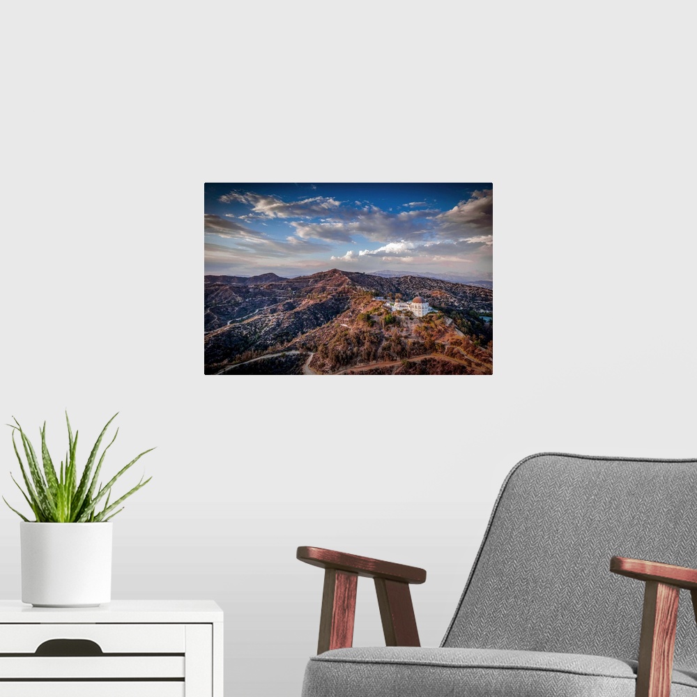 A modern room featuring Aerial view of the Griffith Observatory on the hills outside of Los Angeles, California, at sunset.