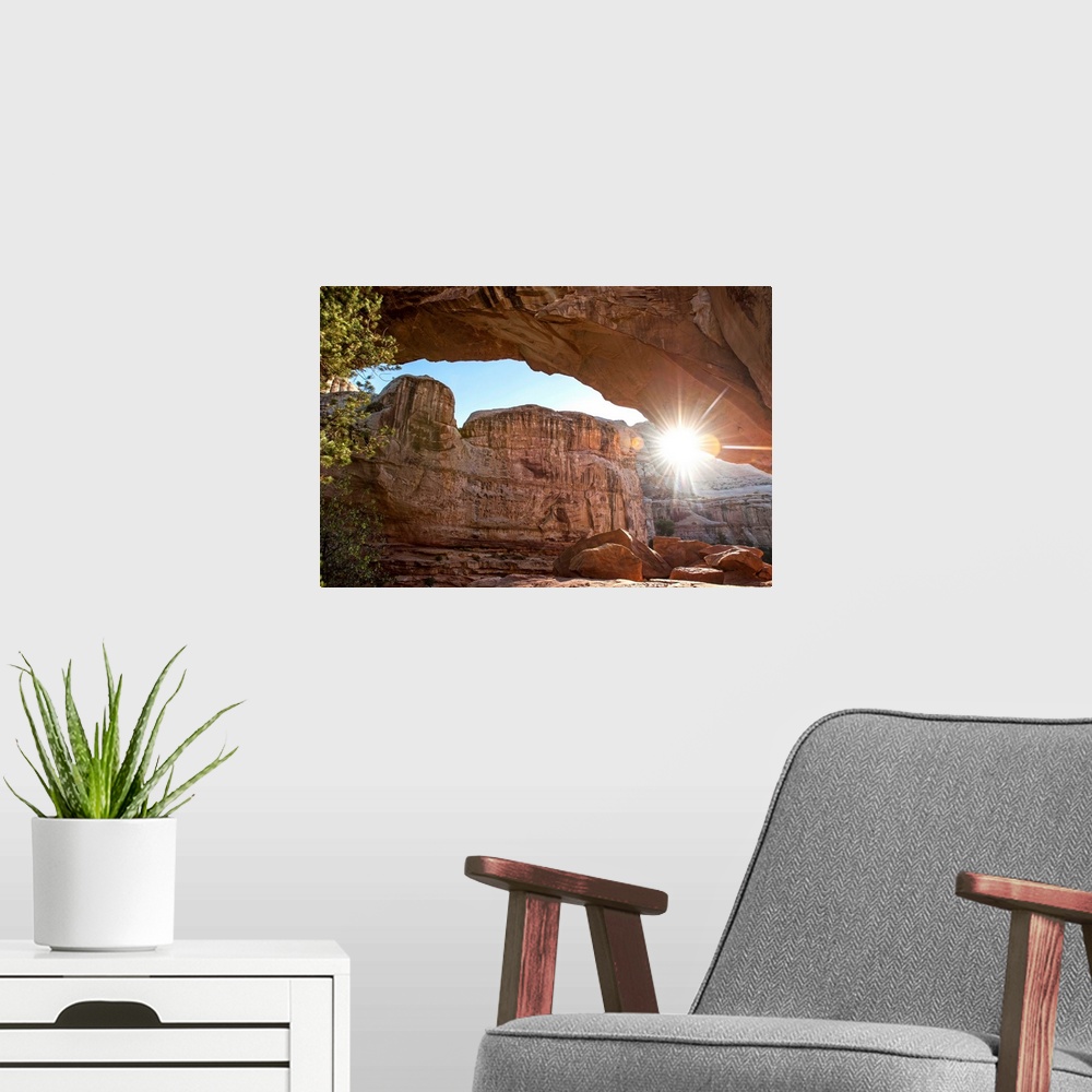 A modern room featuring The sun peeking through Hickman Bridge arch at Capitol Reef National Park in Utah.