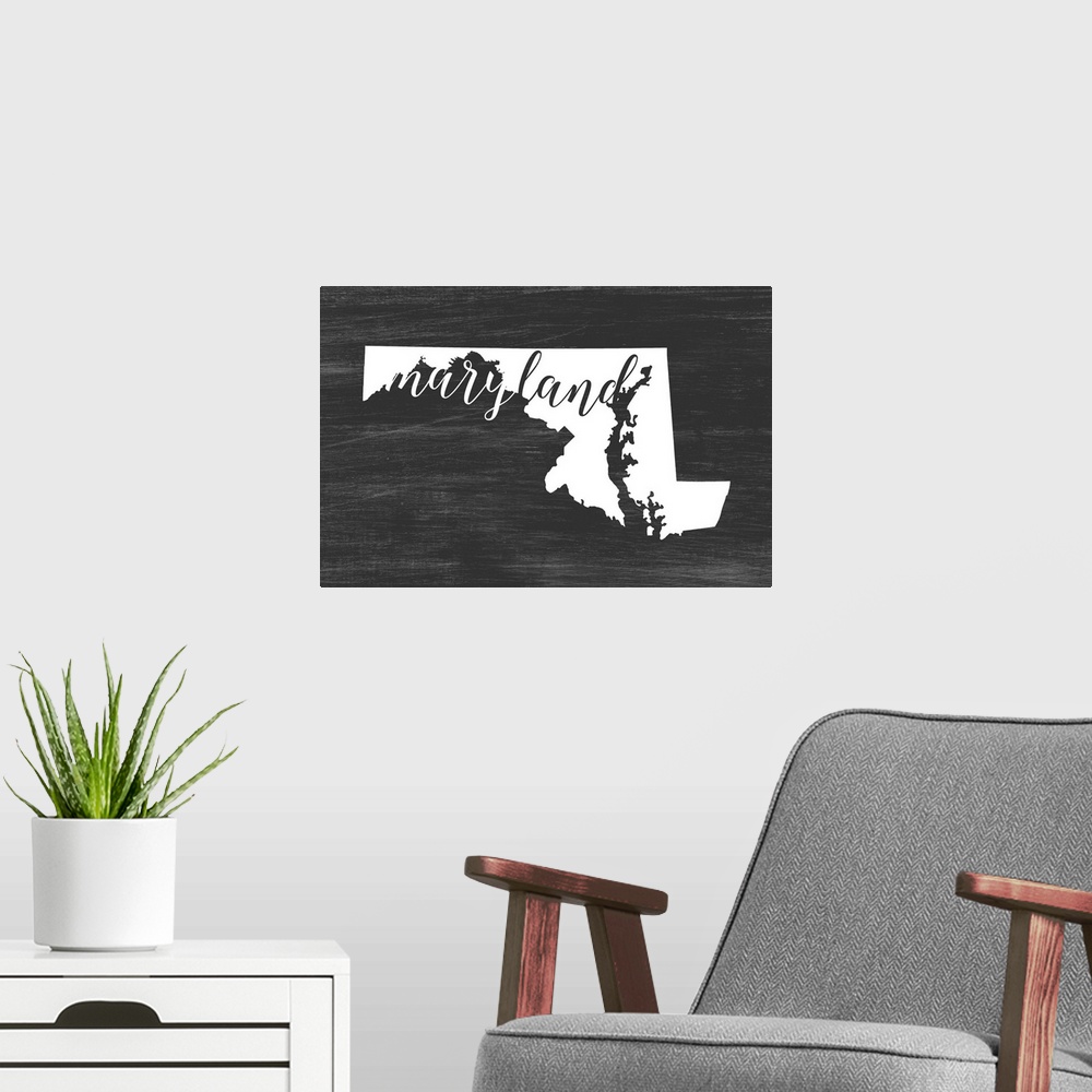 A modern room featuring Maryland state outline typography artwork.