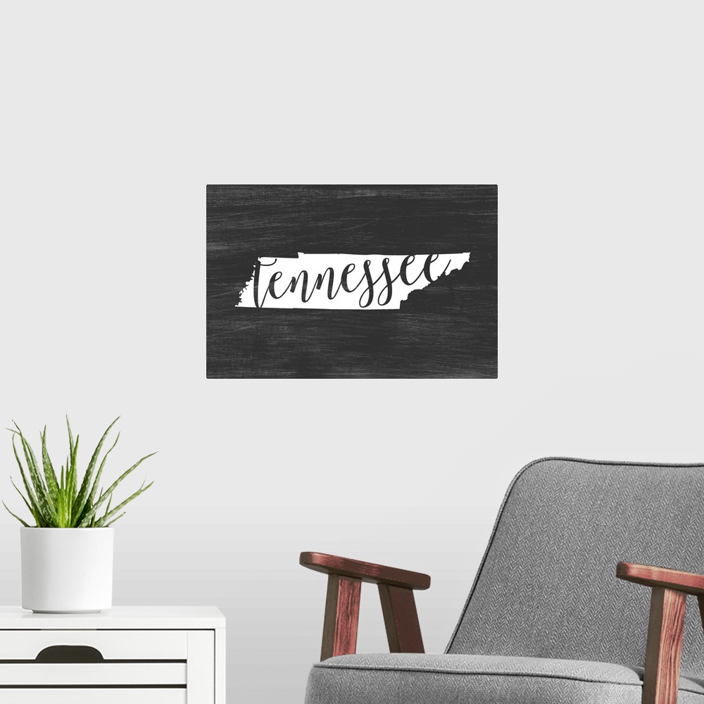 A modern room featuring Tennessee state outline typography artwork.