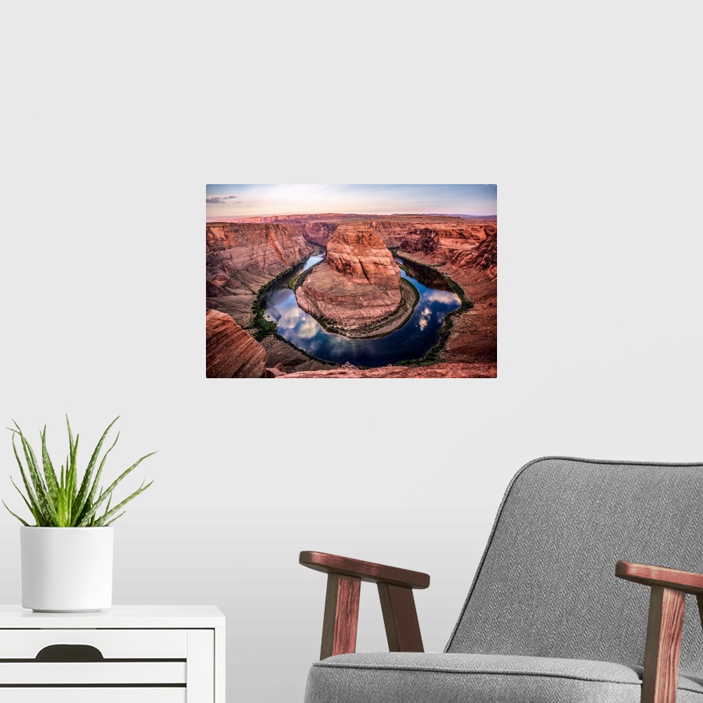 A modern room featuring Landscape photograph of Horseshoe Bend in Page, Arizona with blue cloudy skies reflecting into th...