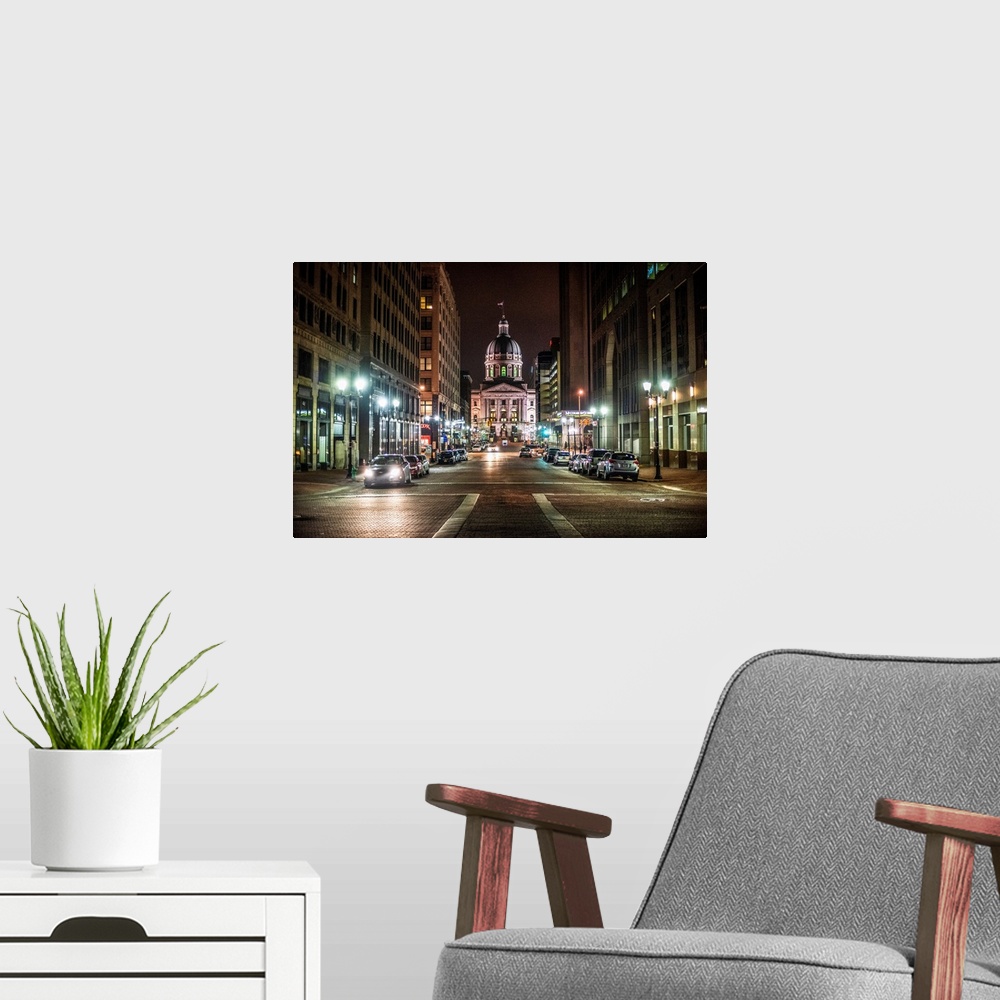 A modern room featuring Photo of the Indiana State House at night.
