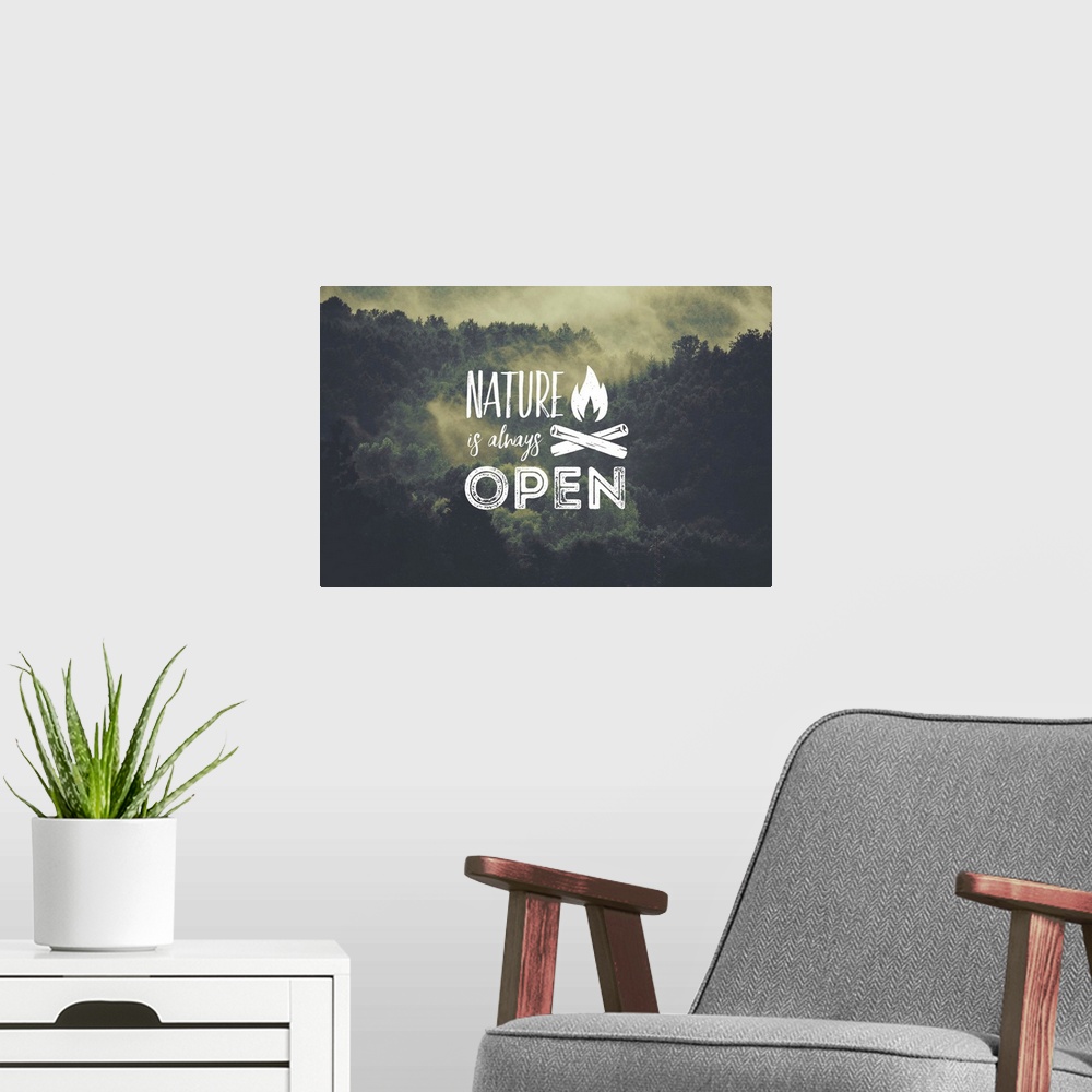 A modern room featuring Typography art against a photograph of a forest scene covered in fog.