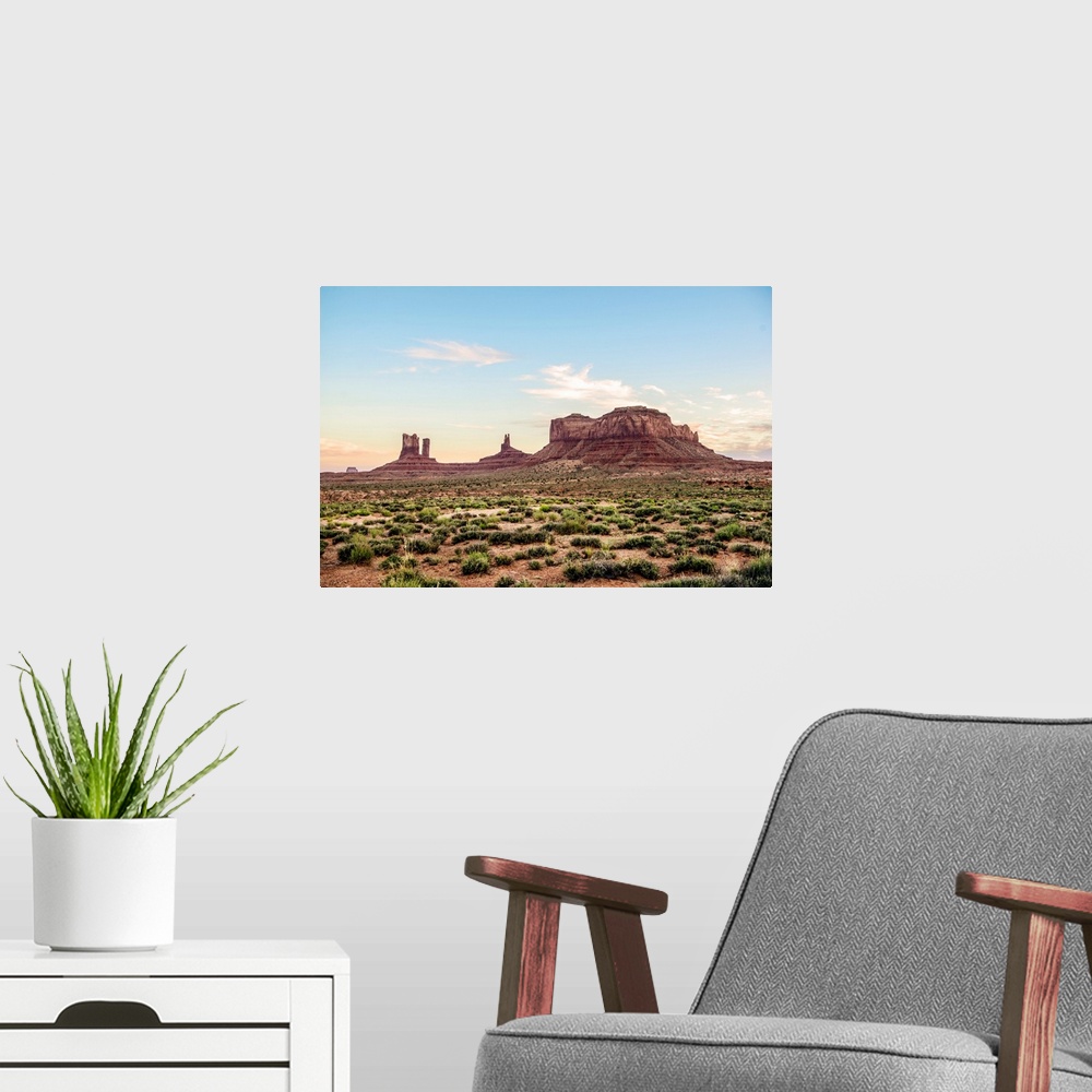 A modern room featuring North view of Brighams Tomb and Stagecoach rock formation in Monument Valley, Utah.