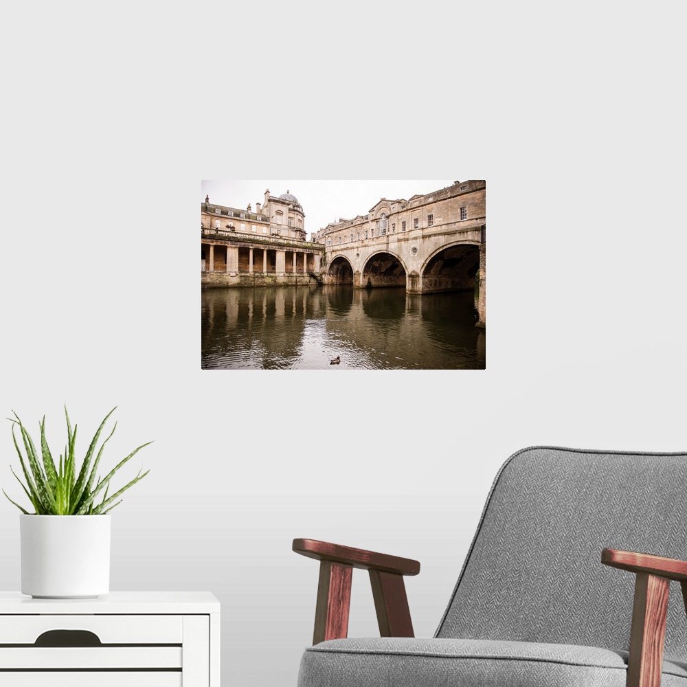 A modern room featuring Photograph of three arched tunnels connected to the Pulteney Bridge in Bath, England, with a duck...