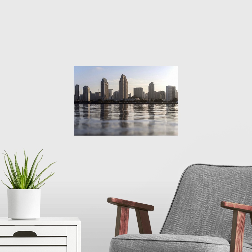 A modern room featuring Photograph of the San Diego, California skyline from the water just before sunset.