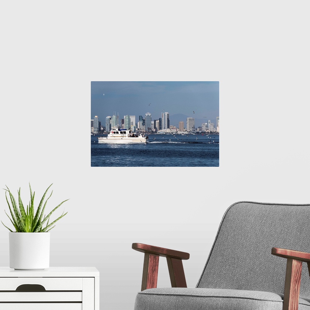 A modern room featuring Photograph of a charter fishing boat on the Pacific Ocean with seagulls flying around it and the ...