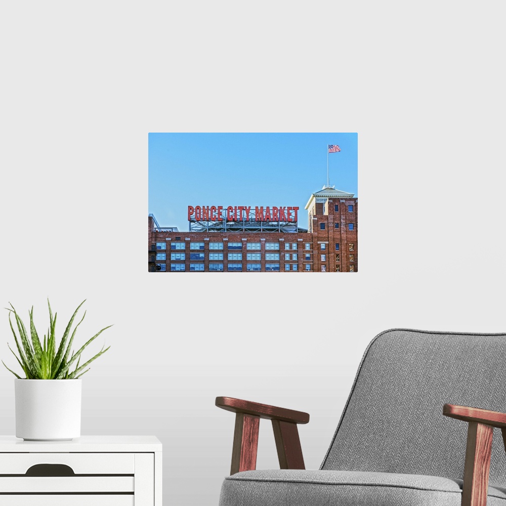 A modern room featuring Tall neon letters on the rooftop terrace of Ponce City Market, a historic Sears, Roebuck and Co. ...