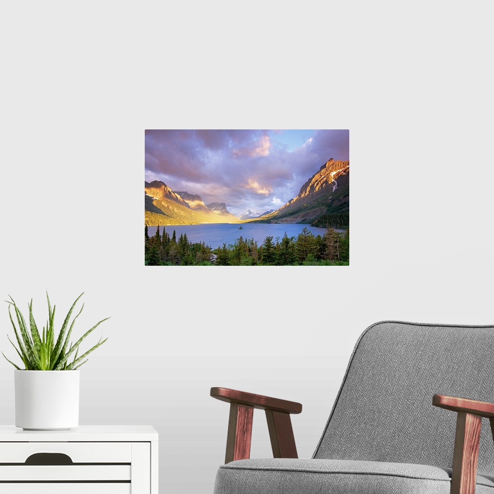 A modern room featuring From the National Geographic Collection.  Photograph of lake lined with mountains with forest in ...