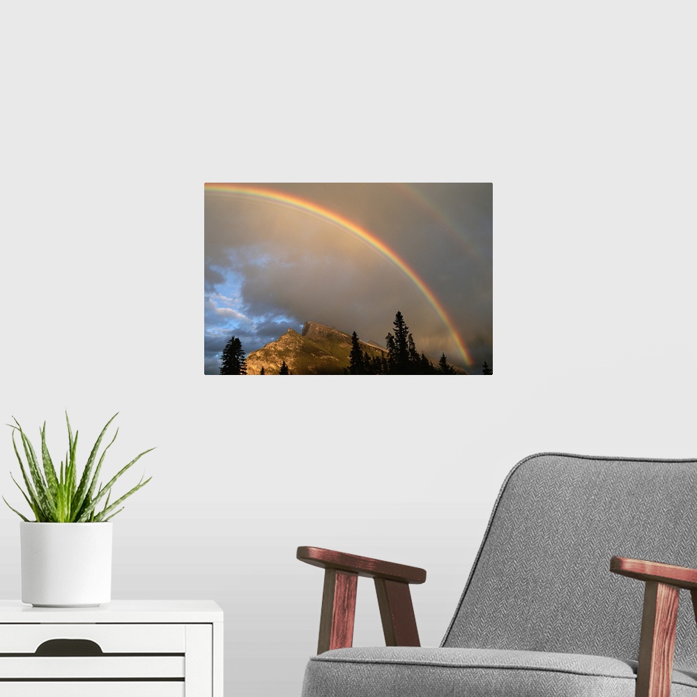 A modern room featuring Rainbow over Mt. Rundle after an early evening thunderstorm.